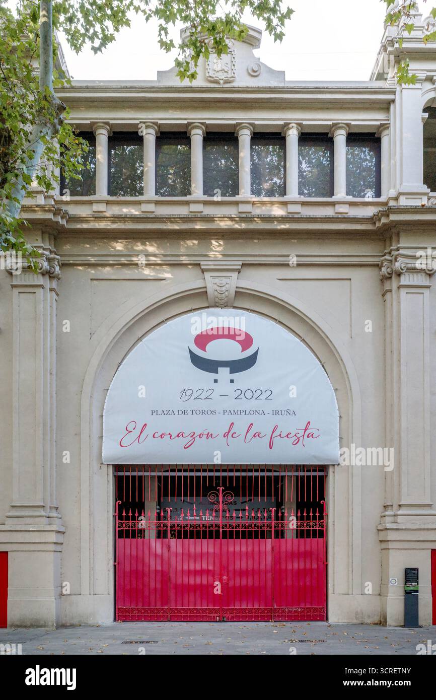 Historic Bullring Entrance with Red Gate in Pamplona, Navarra Spain, Plaza de Toros, San Fermin Festival Venue, Traditional Building, Landmark Stock Photo