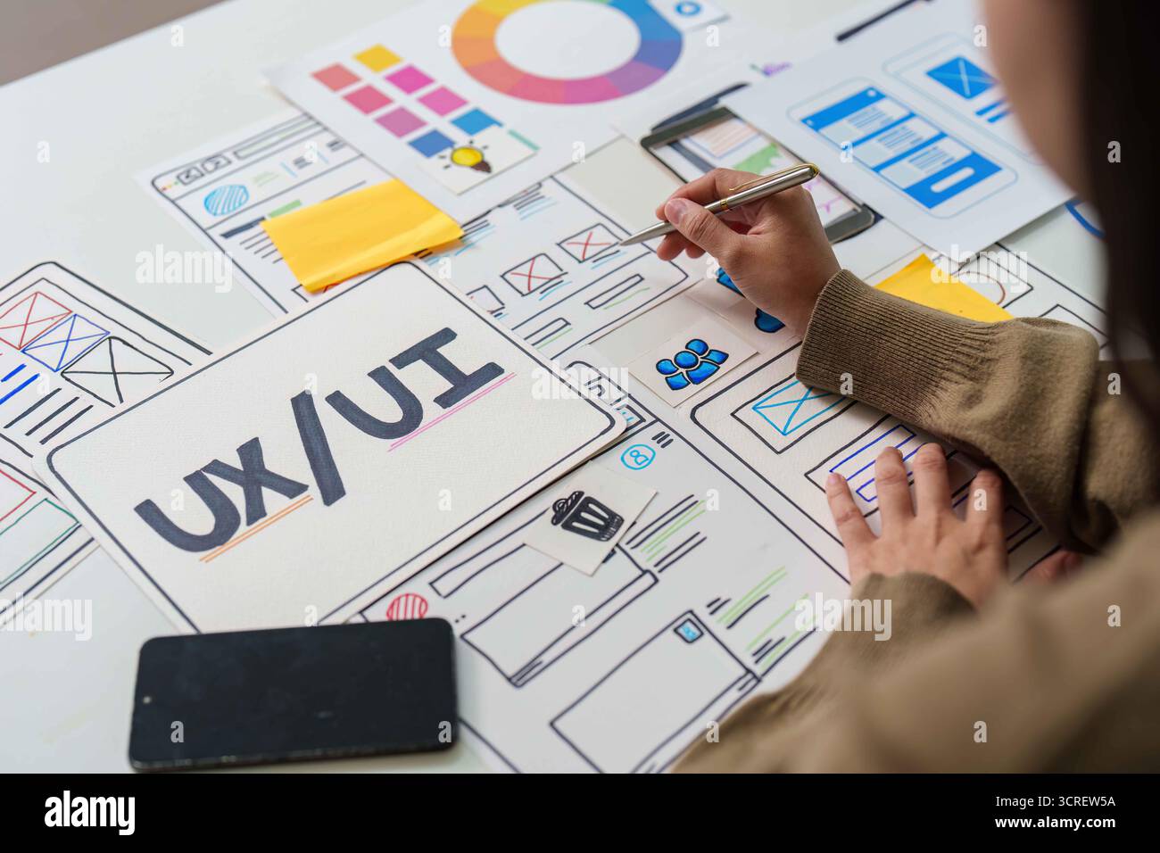 UX UI Design Process. Creative brainstorming session with wireframes and color palettes. Stock Photo