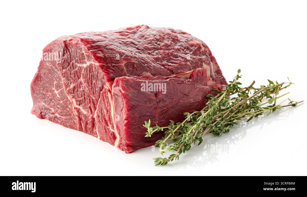 fresh raw beef meat with thyme isolated on white background Stock Photo