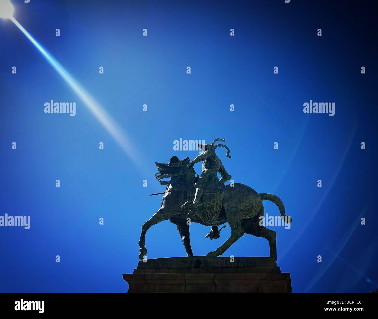 The sun shines over the statue of Spanish conquistador Francisco Pizarro iin Trujillo, Cáceres province, Extremadura, Spain - Smartphone Captured Stock Image