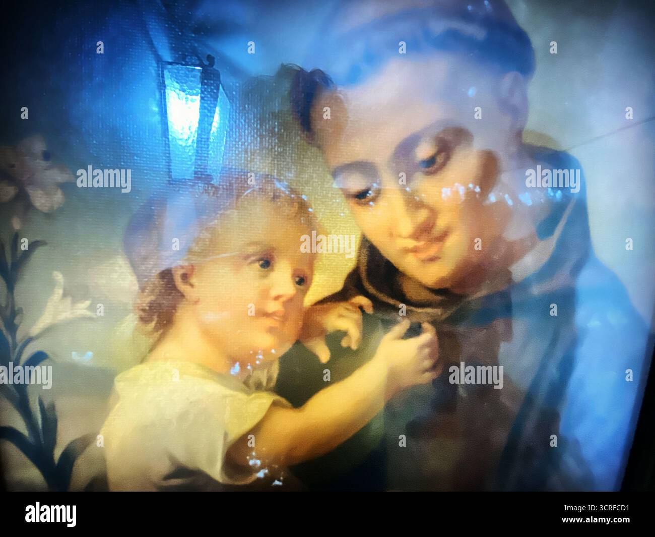 Flowers and a sign reading 'Santo Antonio' decorate a wall in the natal house of Saint Anthony of Lisboa os San Antonio de Padua, in Lisboa, Portugal. - Smartphone Captured Stock Image