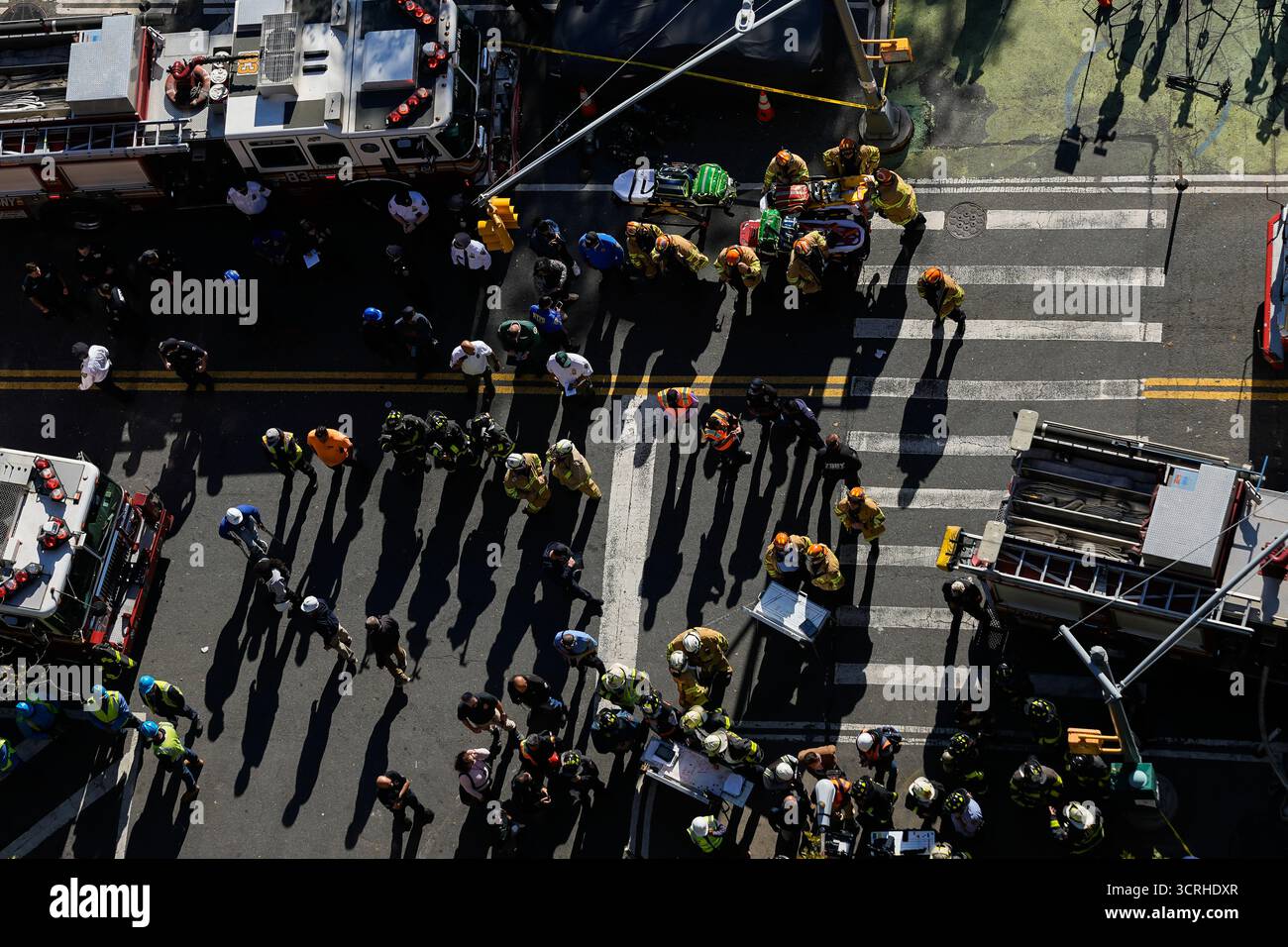 Firefighters work near the site of a building collapse in the Bronx ...