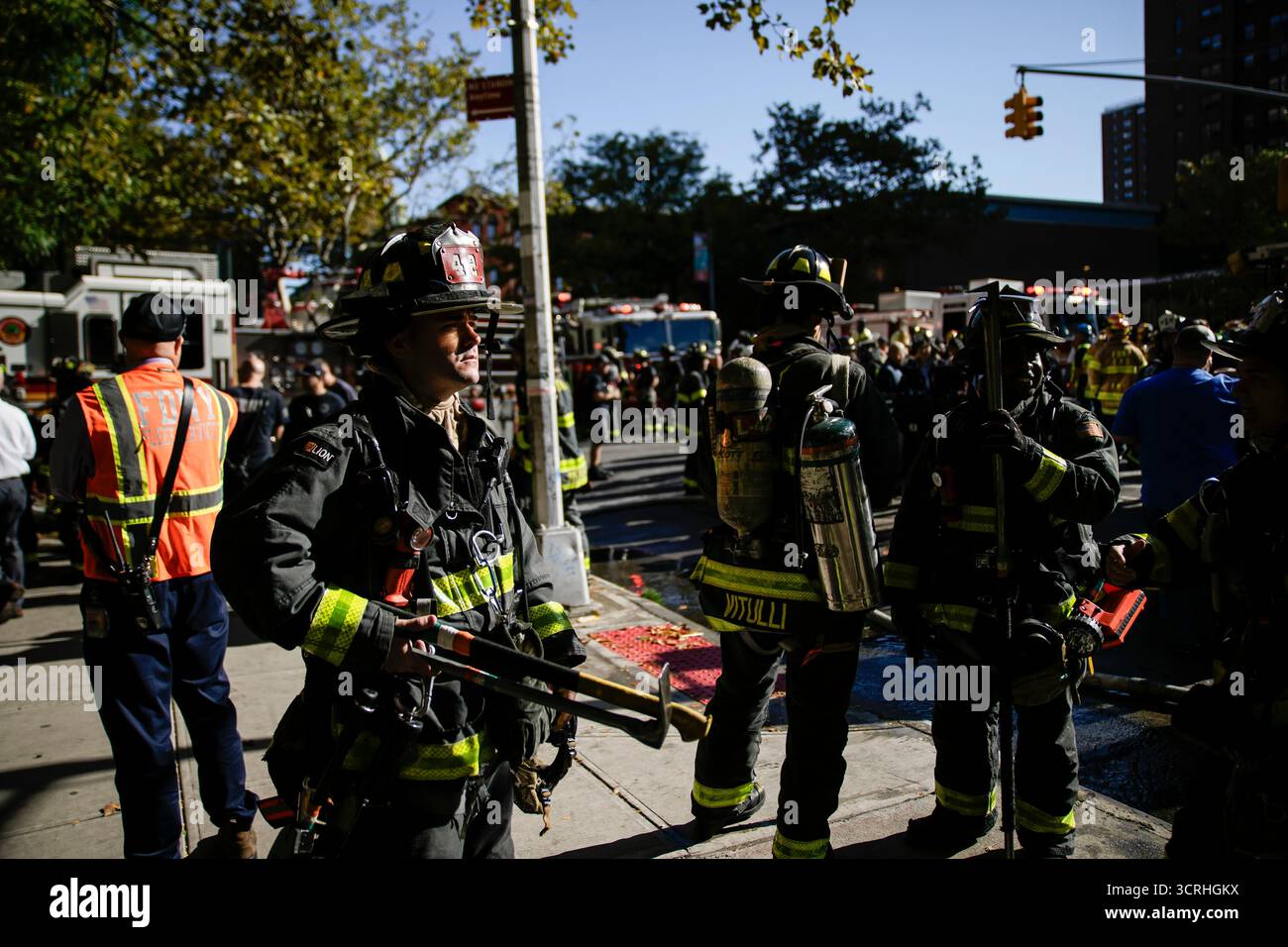 Firefighters work near the site of a building collapse in the Bronx ...