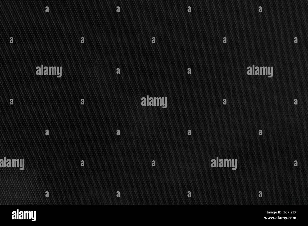 Smooth black surface features subtle pattern, ideal for backgrounds or design uses in various creative projects and presentations. Stock Photo