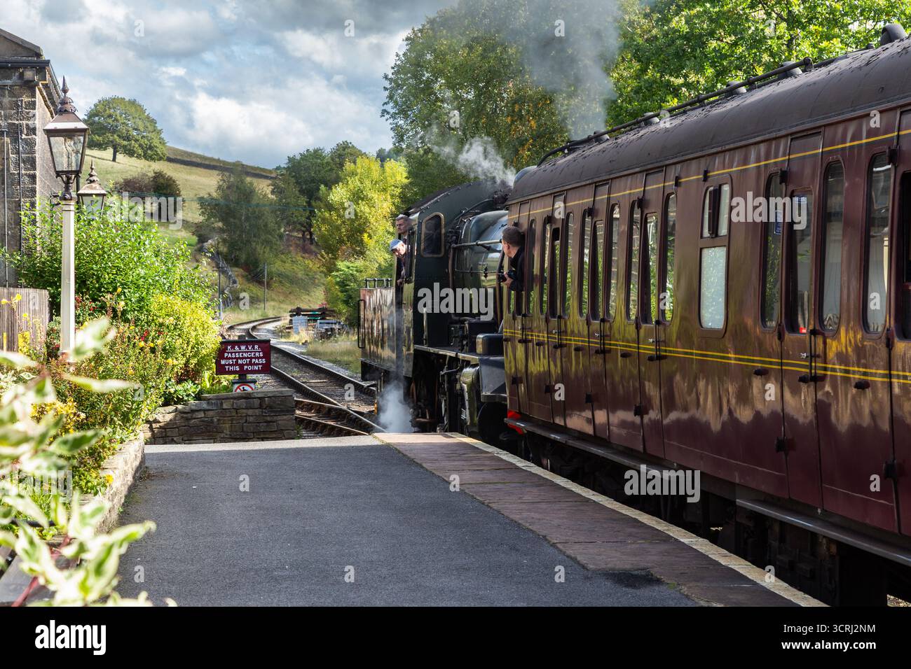 Steam train 78022 BR Standard Class 2MT leaving Oakworth Station on the ...