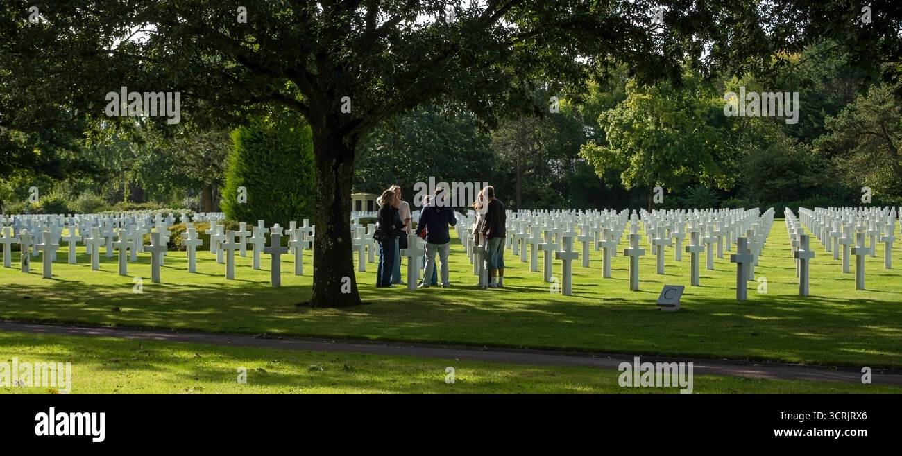 People in the American cemetery at Omaha Beach, Nornamdy, France Stock Photo