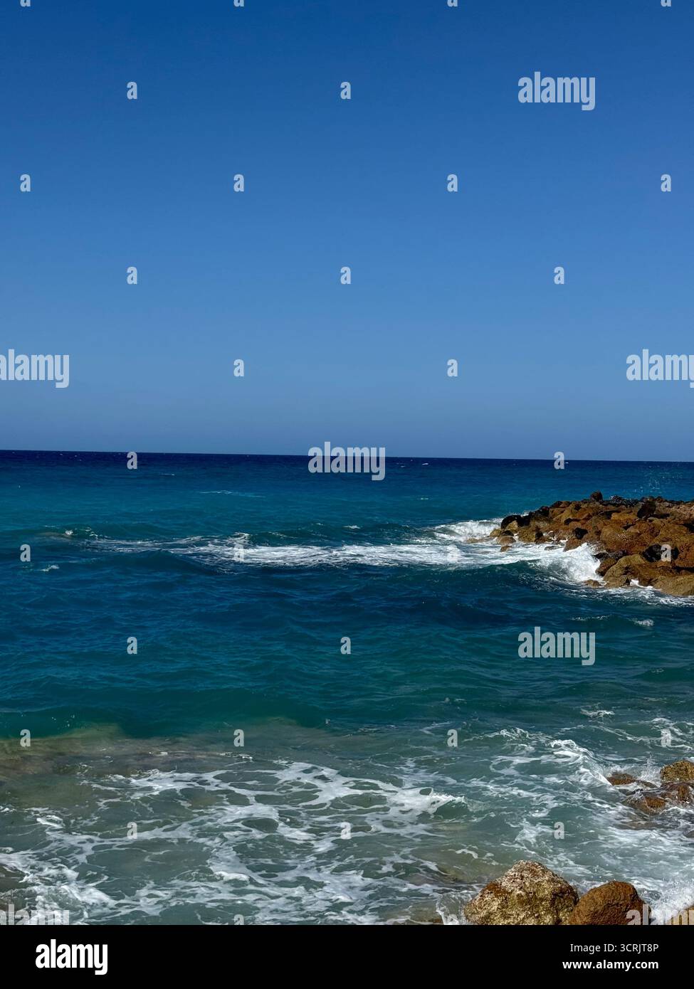Where the waves hit the rocks serenity lies. - Smartphone Captured Stock Image