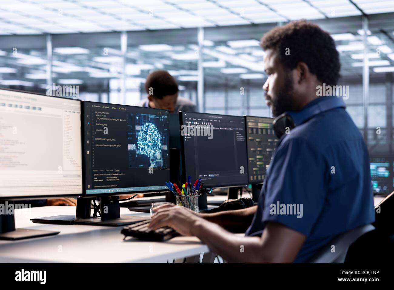 Data center professional doing AI research, implementing algorithms using machine learning. Computer scientist in server room workspace using artificial intelligence computational models Stock Photo