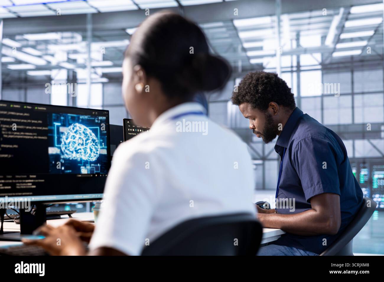 Server hub workspace IT professional using AI systems to input data faster and solve complex computational tasks. Data center worker using artificial intelligence parallel processing technology Stock Photo