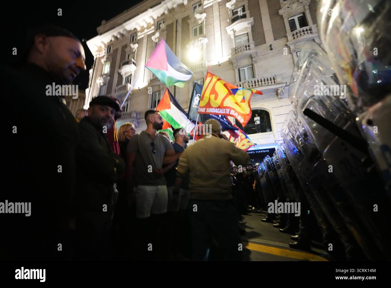 Pro-Palestinian activists face anti-riot police as they march in ...