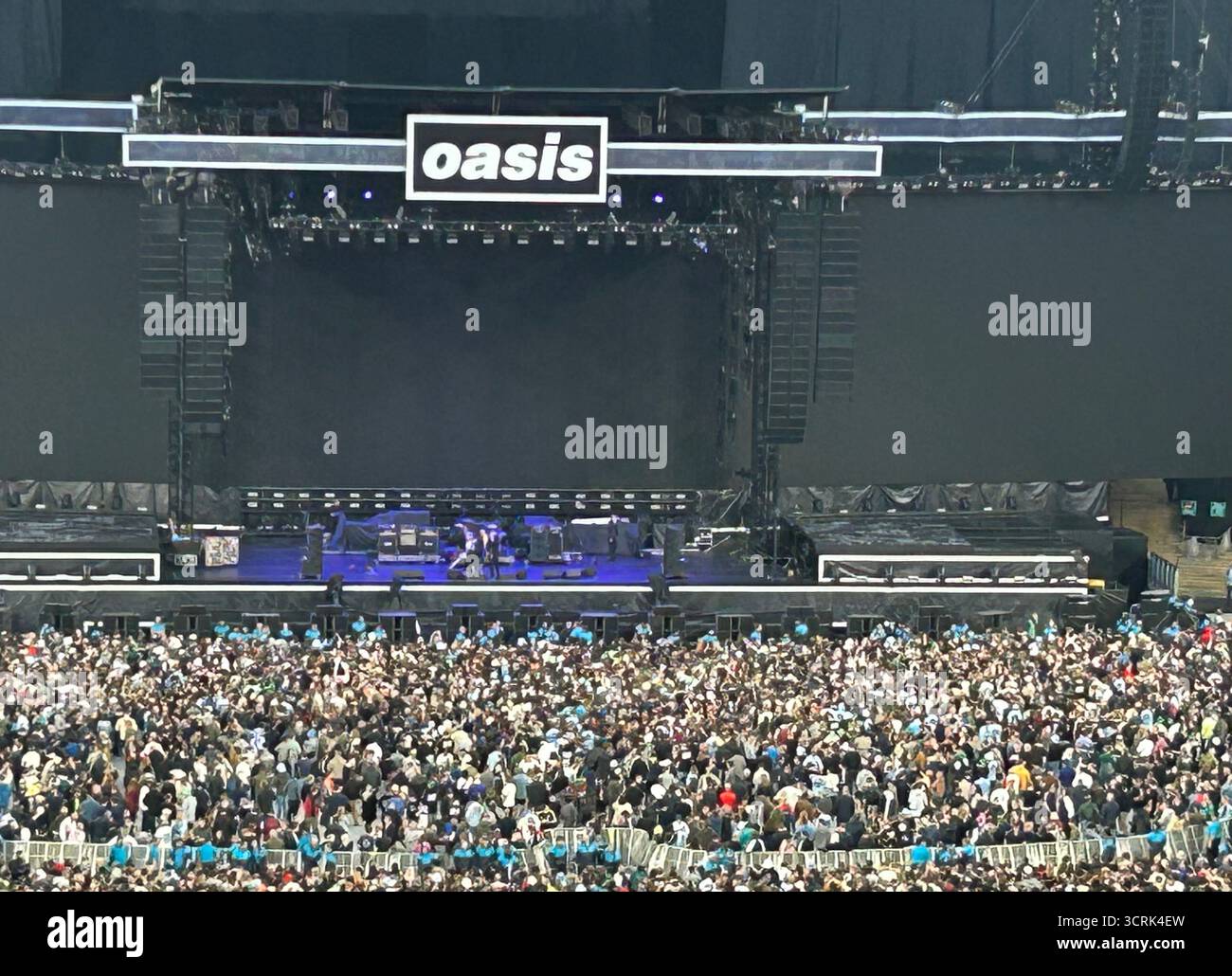 Large crowd wait to see Oasis play their final Wembley concert of the UK Live 25 tour on Sunday 28th September 2025, London, UK - Smartphone Captured Stock Image