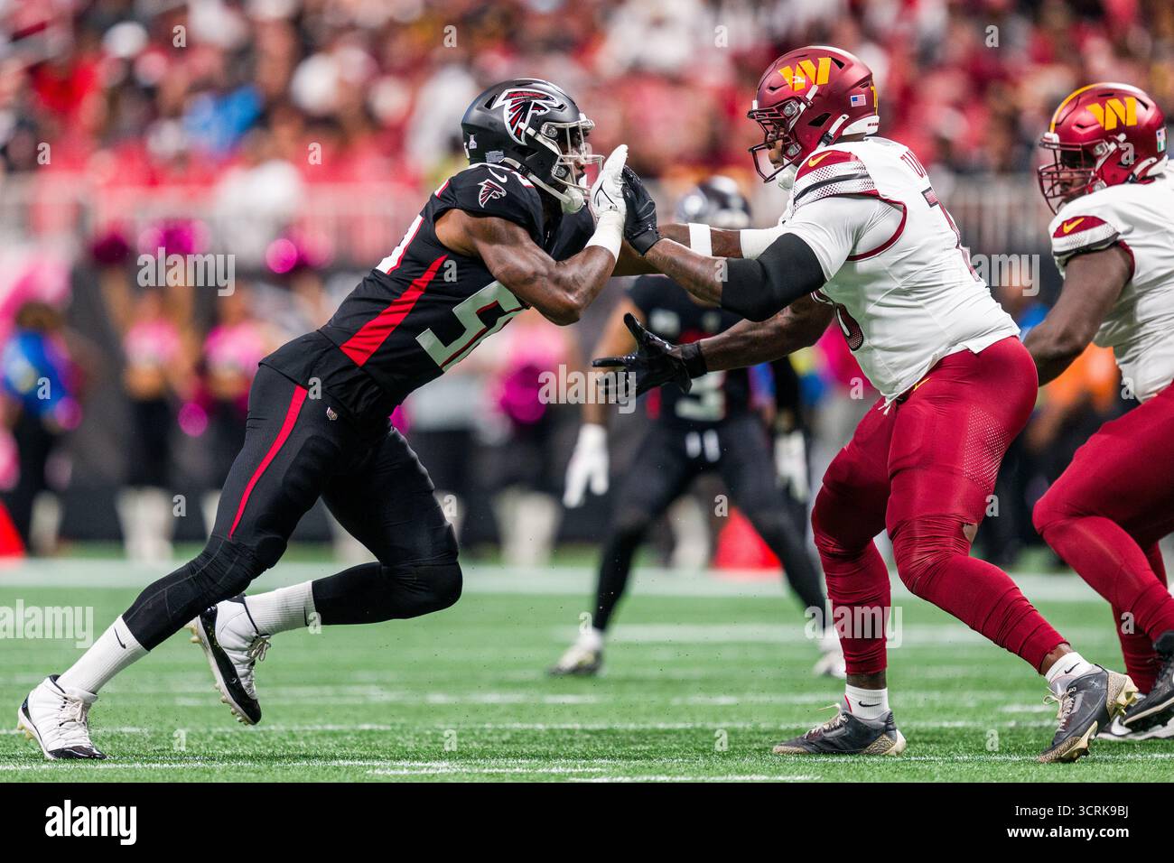 Washington Commanders linebacker Kain Medrano (56) works against ...