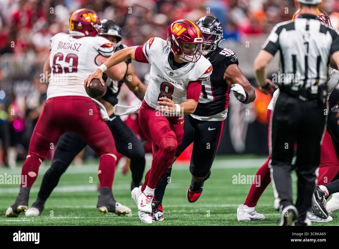 Washington Commanders quarterback Marcus Mariota (8) rolls out during ...