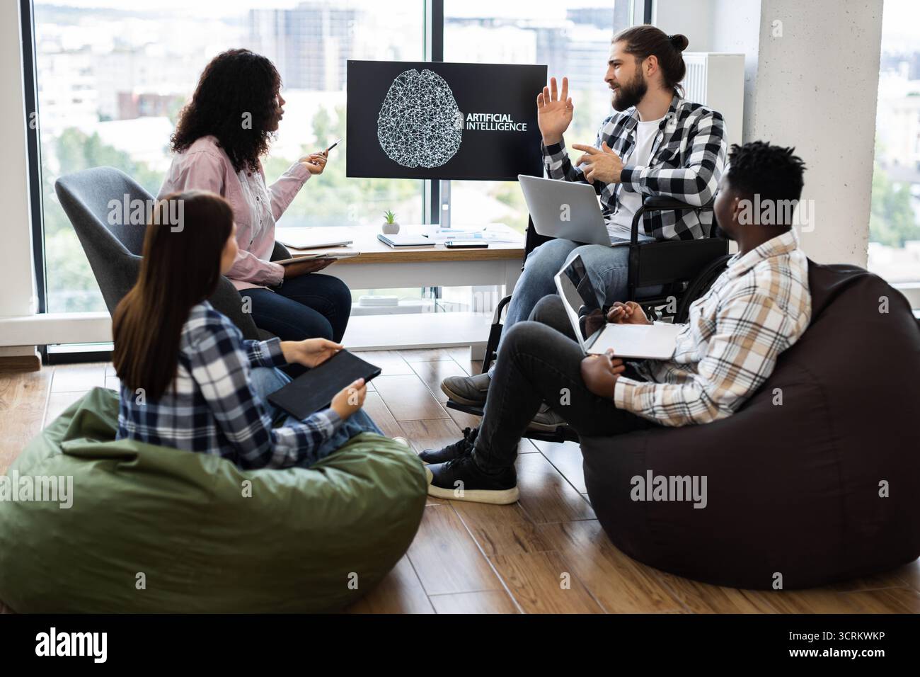 Team collaborating on artificial intelligence project in modern office setting Stock Photo