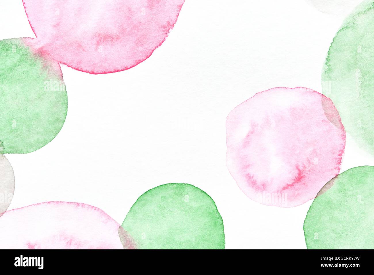 Abstract watercolor artwork with pink and green circular shapes on white background. Stock Photo
