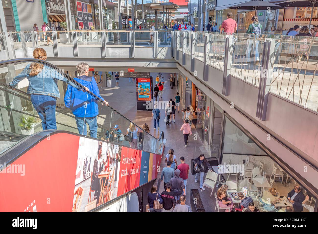Busy Shopping Mall Interior with Multiple Levels and Shoppers on ...