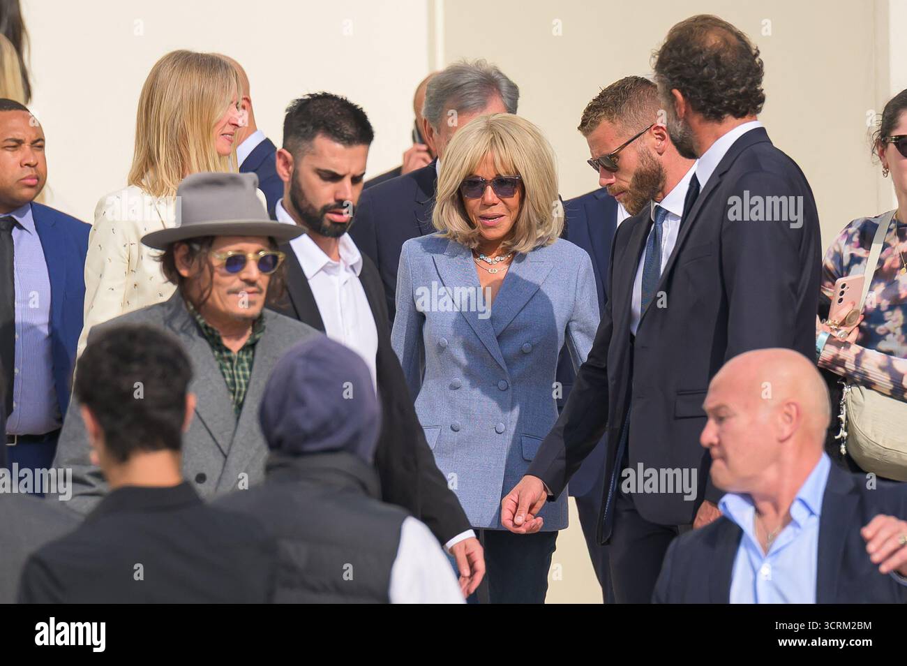 Johnny Depp and Brigitte Macron attend the Christian Dior Womenswear