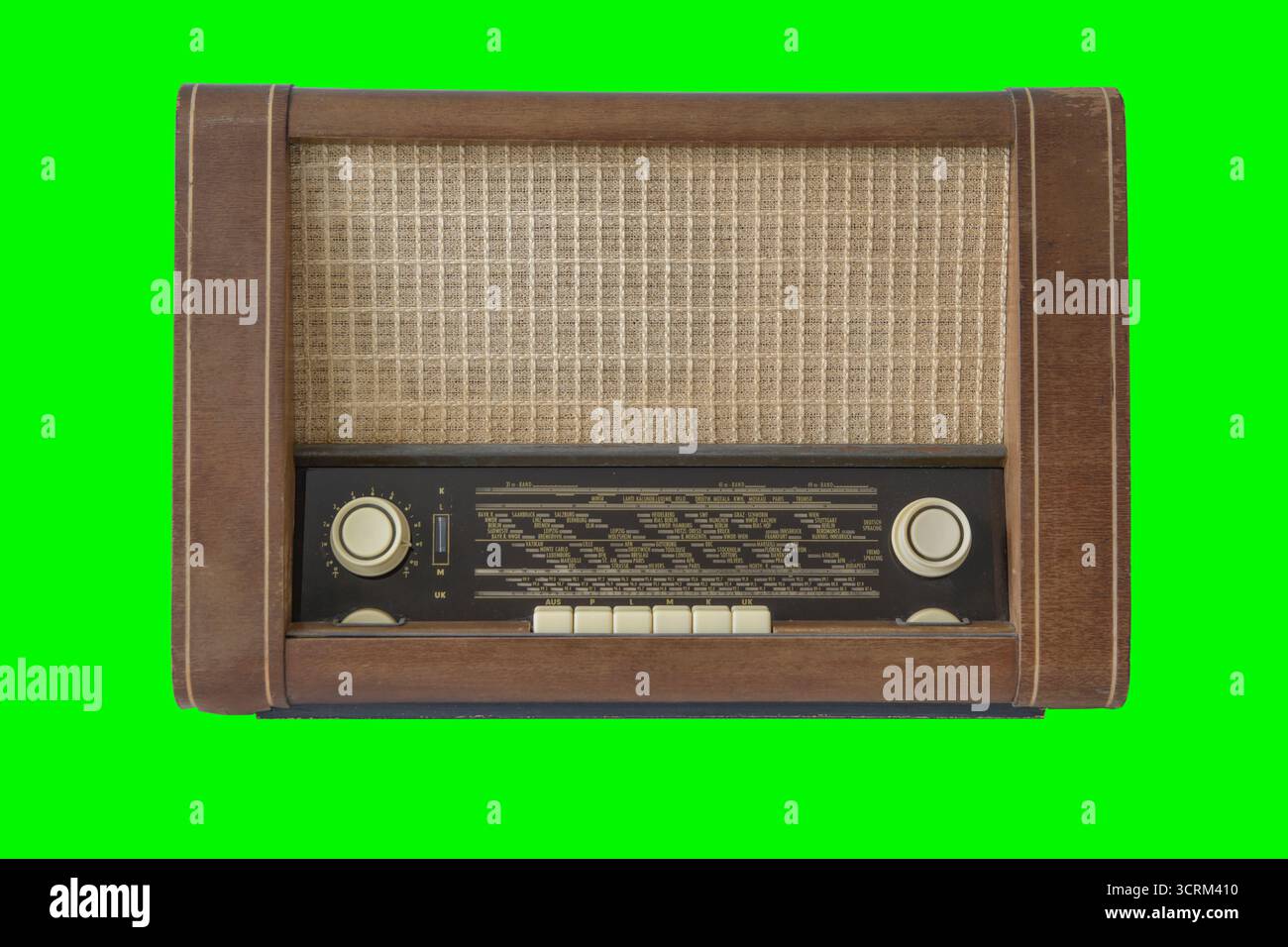 Authentic 50-60s radio receiver. Vintage. Isolated on green background. Stock Photo