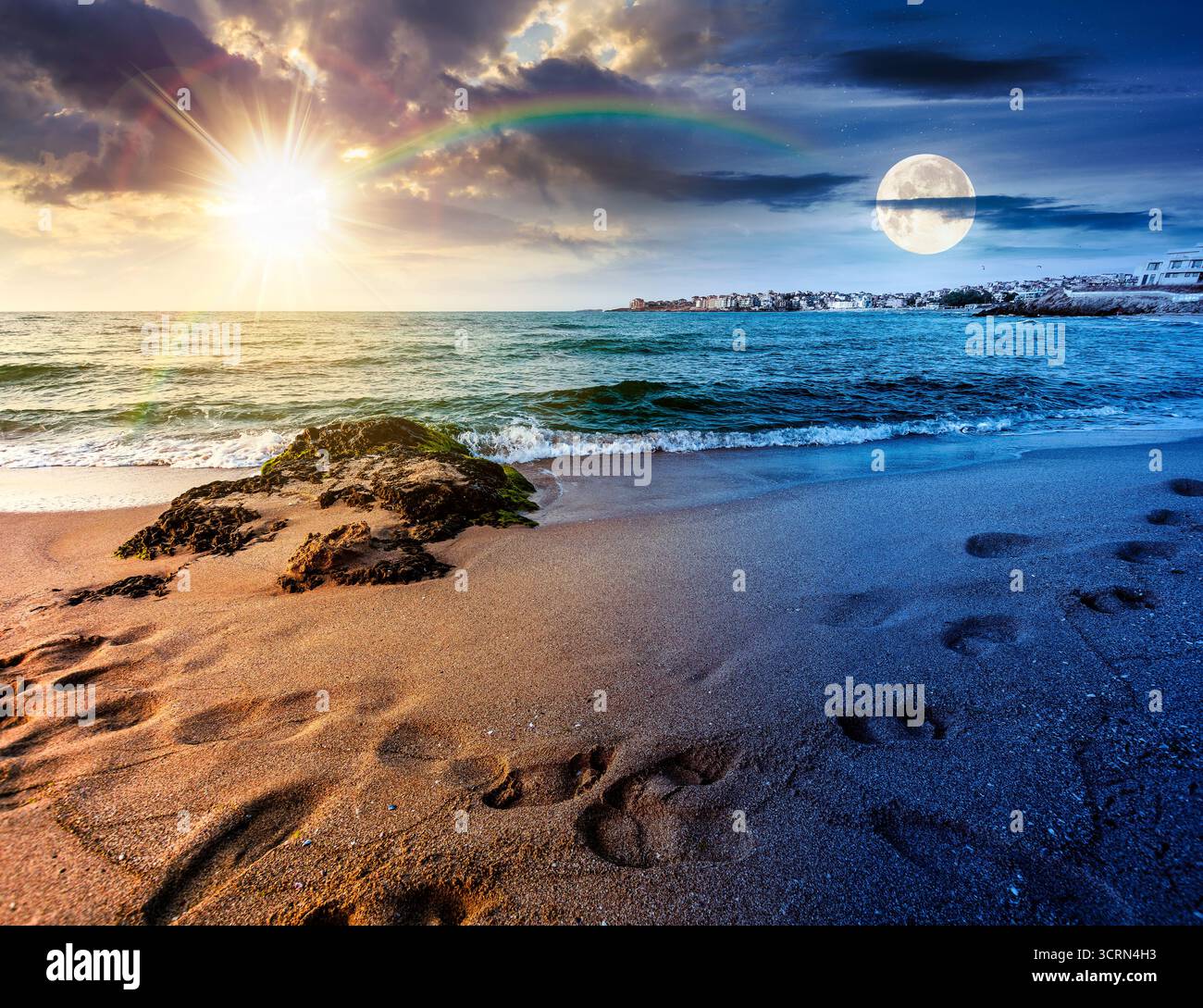 sunrise on a sandy town beach on equinox season. day and night time change concept. beautiful and warm weather on the shores of black sea. coast with Stock Photo