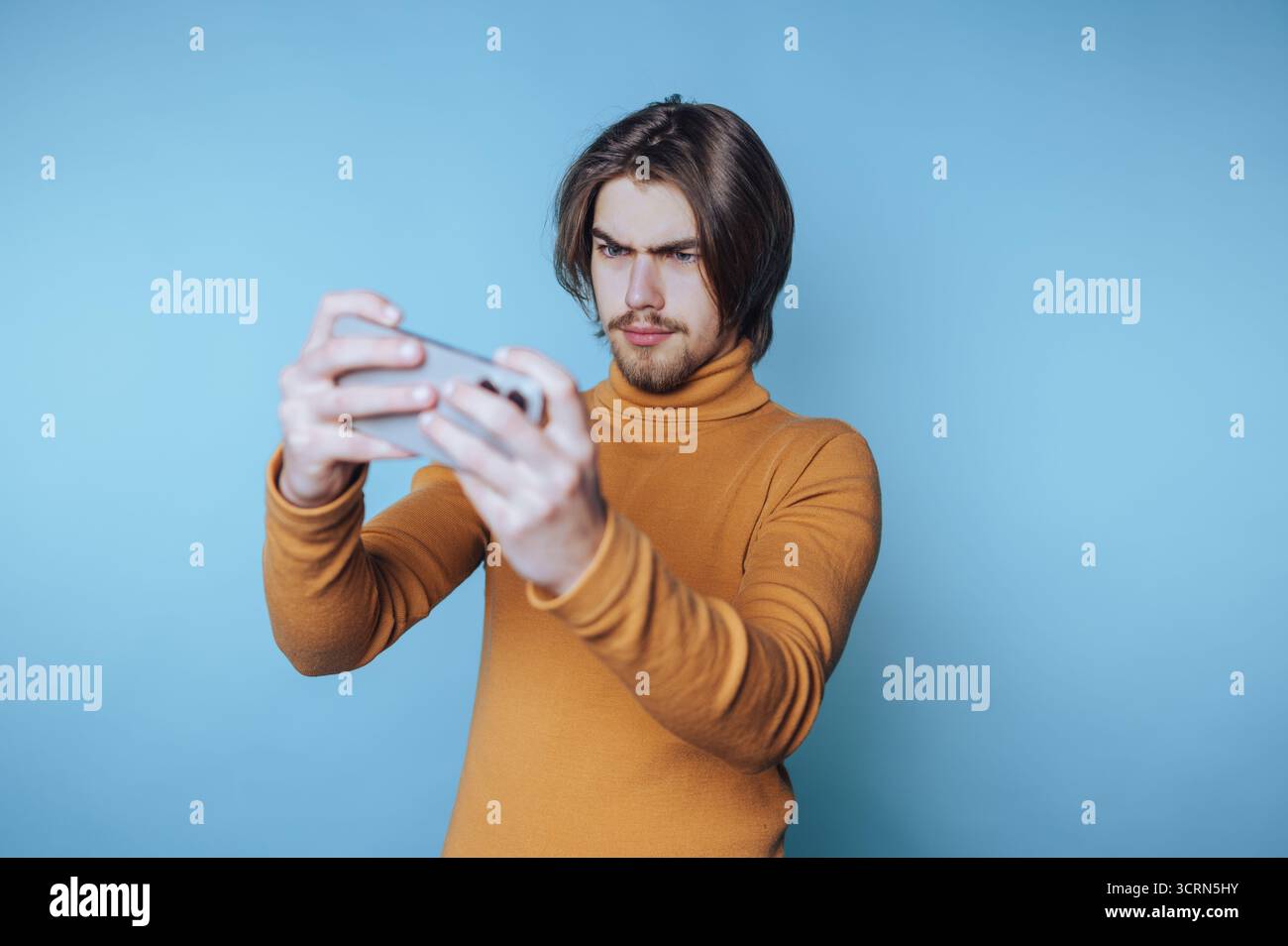 Man in blue sweater on hi-res stock photography and images - Alamy