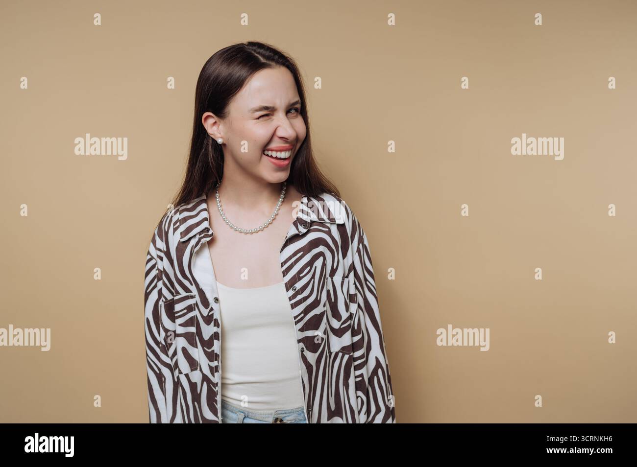 Female wearing beige top hi-res stock photography and images - Alamy
