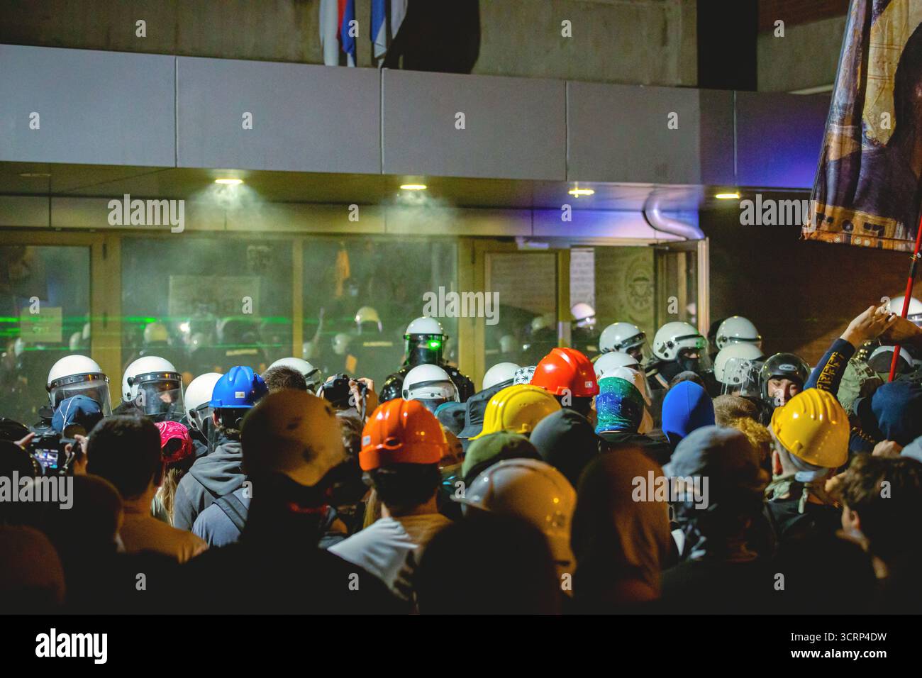 Riot police with full equipment stand guard in cordon, helmet, mask ...