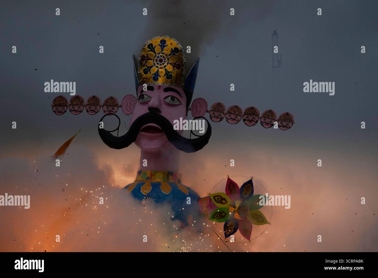 An effigy of mythical demon king Ravana goes up in flames marking the ...