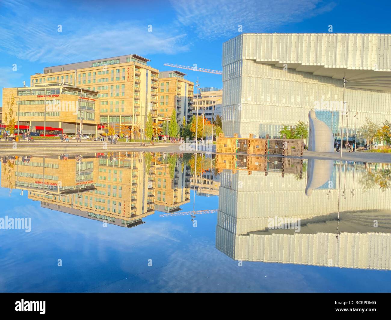 The late autumn sun lights up the ÔDeichman Bj¿rvikaÕ new main library facing the waterfront and harbour in Oslo, Norway.  The municipal public librar - Smartphone Captured Stock Image