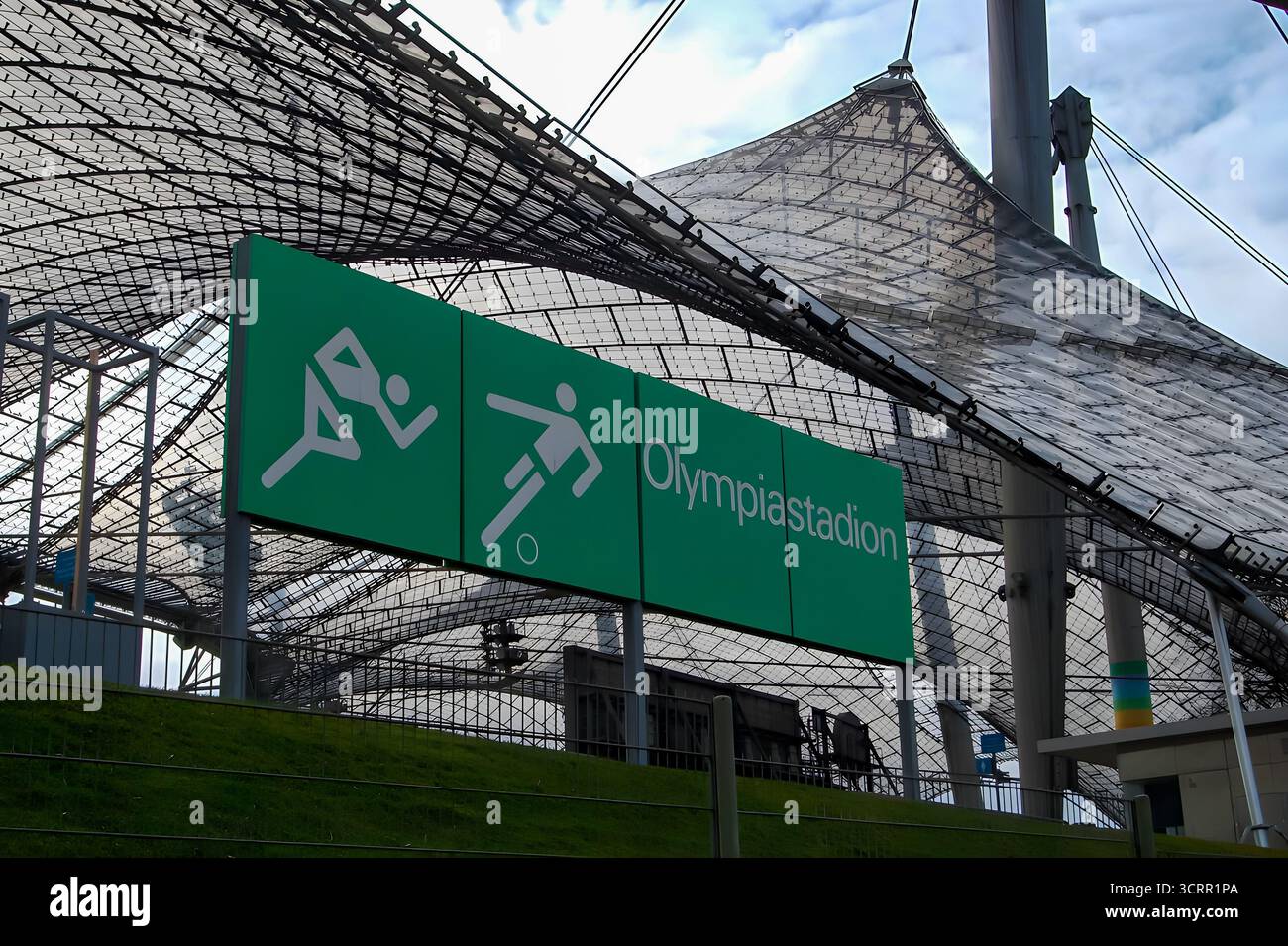 Olympiastadion sign beneath Munich’s iconic tensile roof structure. Stock Photo