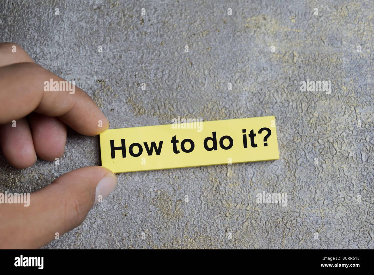 Concept of how to do it write on sticky notes isolated on Wooden Table. Stock Photo