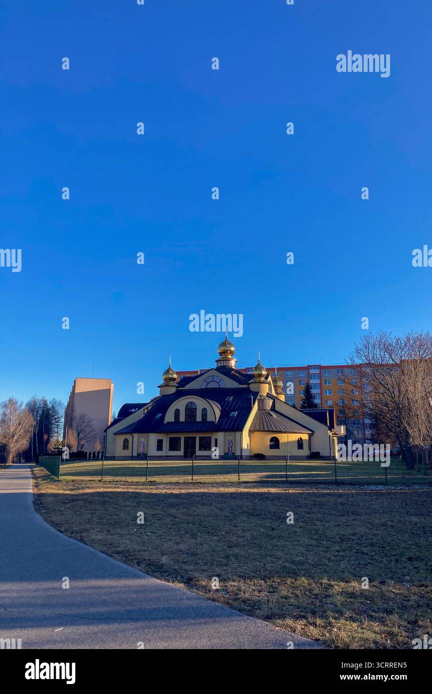 SLOVAKIA, POPRAD - DECEMBER 29, 2024: The Byzantine Catholic Church of Saints Peter and Paul in Poprad, Slovakia, features traditional Eastern Christi - Smartphone Captured Stock Image