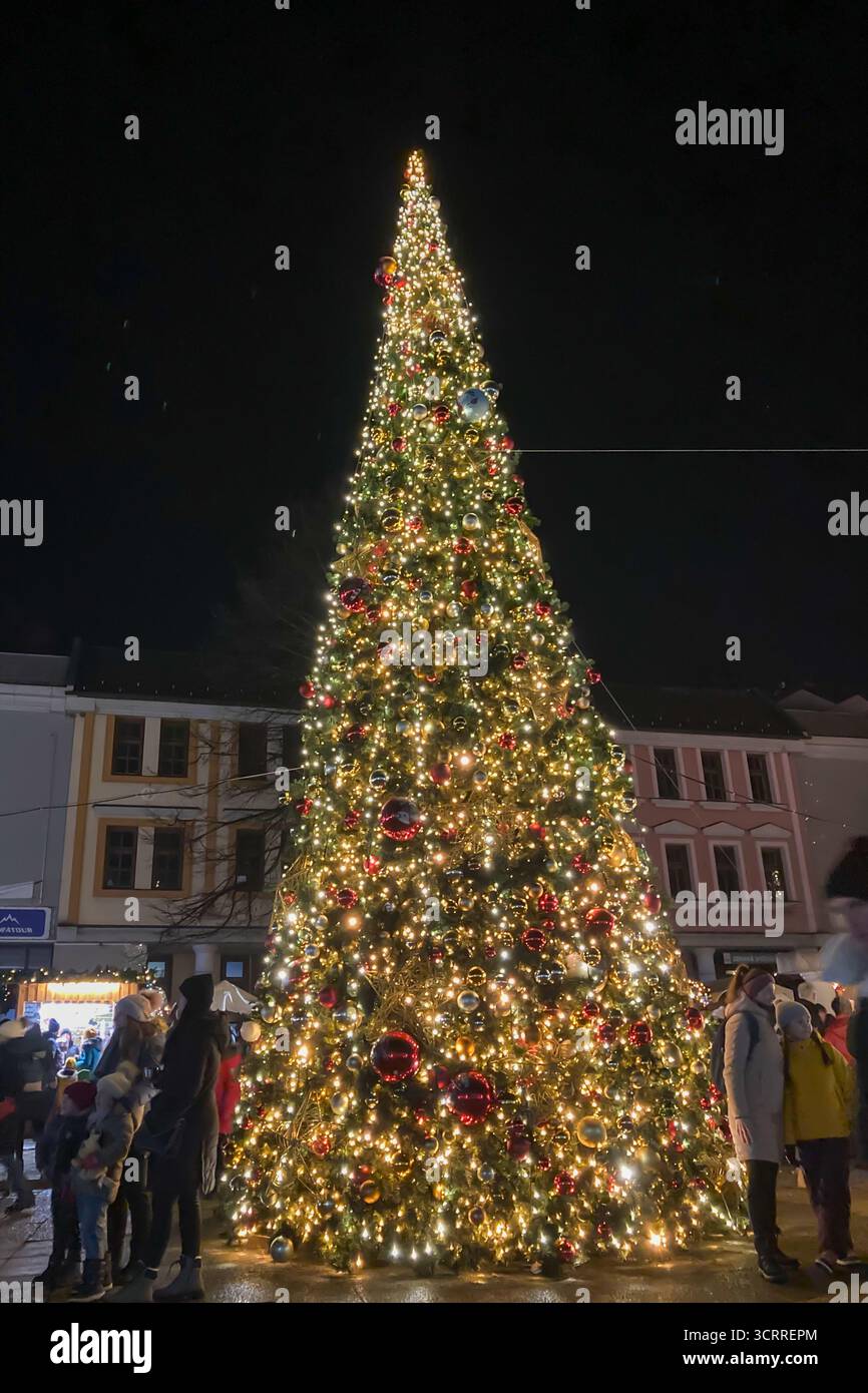 SLOVAKIA, POPRAD - DECEMBER 29, 2024: The city center of Poprad glows with a magical Christmas atmosphere, featuring festive lights, decorated trees, - Smartphone Captured Stock Image