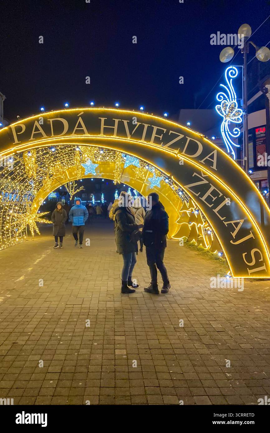 SLOVAKIA, POPRAD - DECEMBER 29, 2024: The city center of Poprad glows with a magical Christmas atmosphere, featuring festive lights, decorated trees, - Smartphone Captured Stock Image