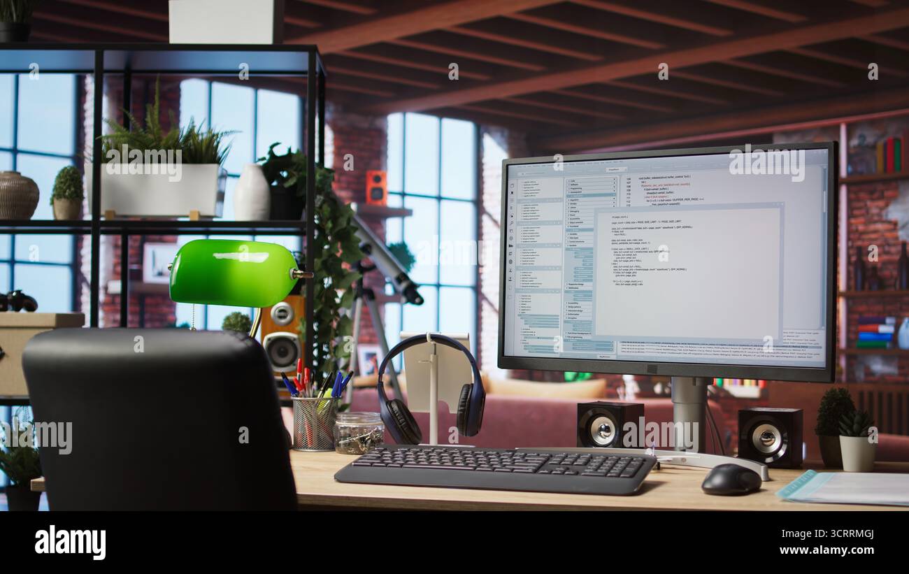 UI on PC screen in home office with programming code being executed. Coding application UI used by IT programmers to write and test code in modern apartment, panning shot Stock Photo
