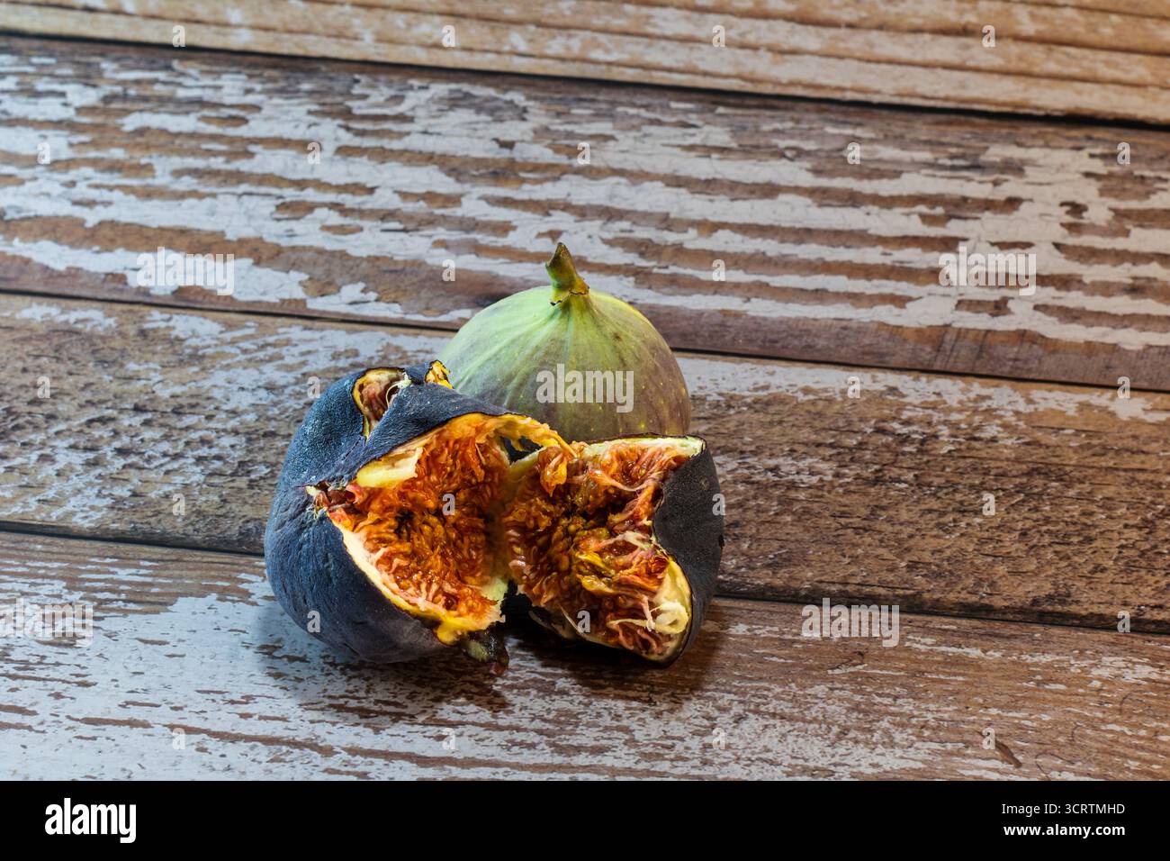 fresh figs on rustic wooden surface Stock Photo