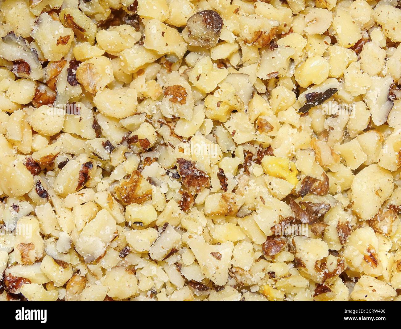 Chopped walnut kernels. Walnut background Stock Photo