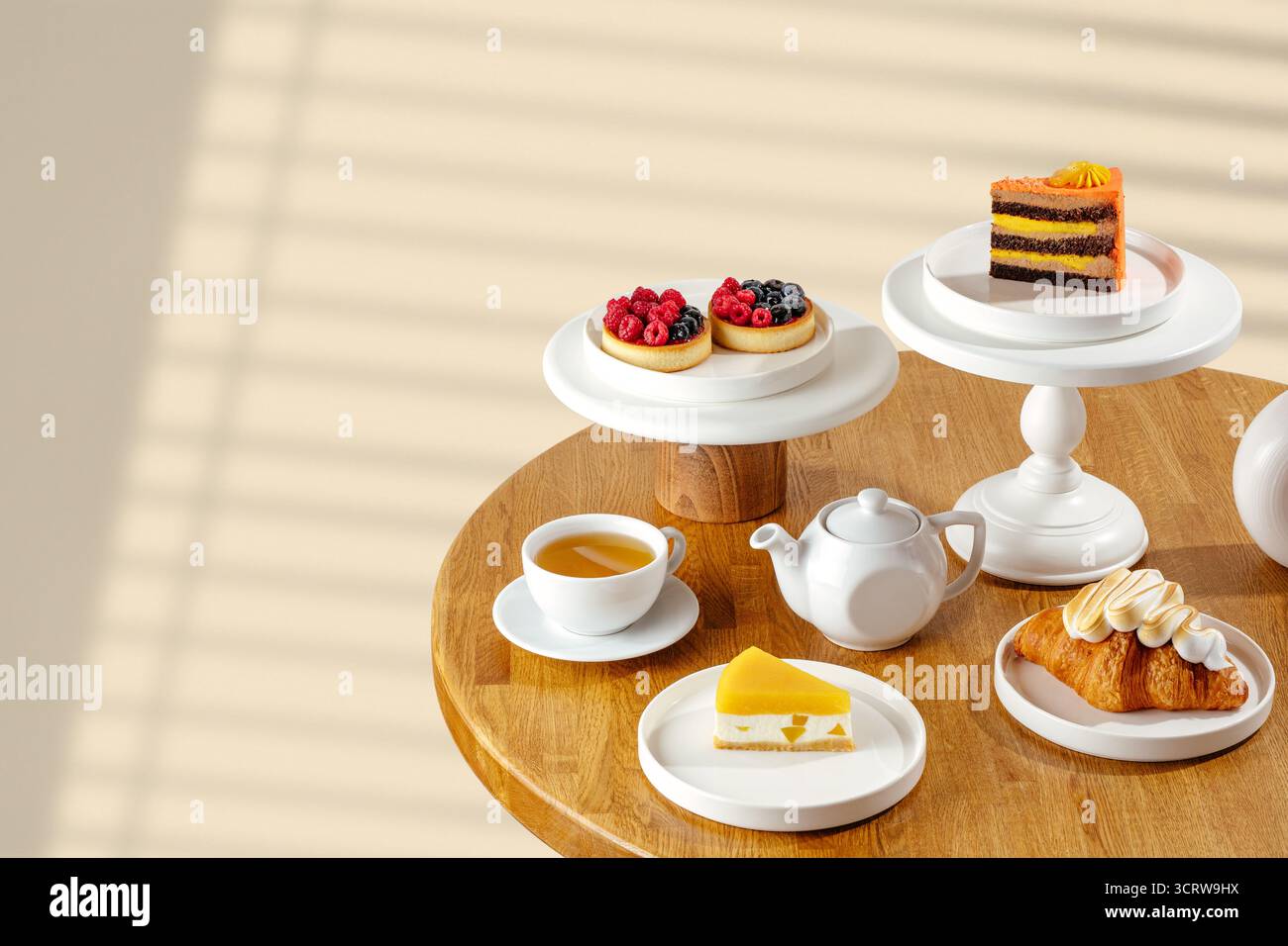 Assorted desserts at a cafe table Stock Photo