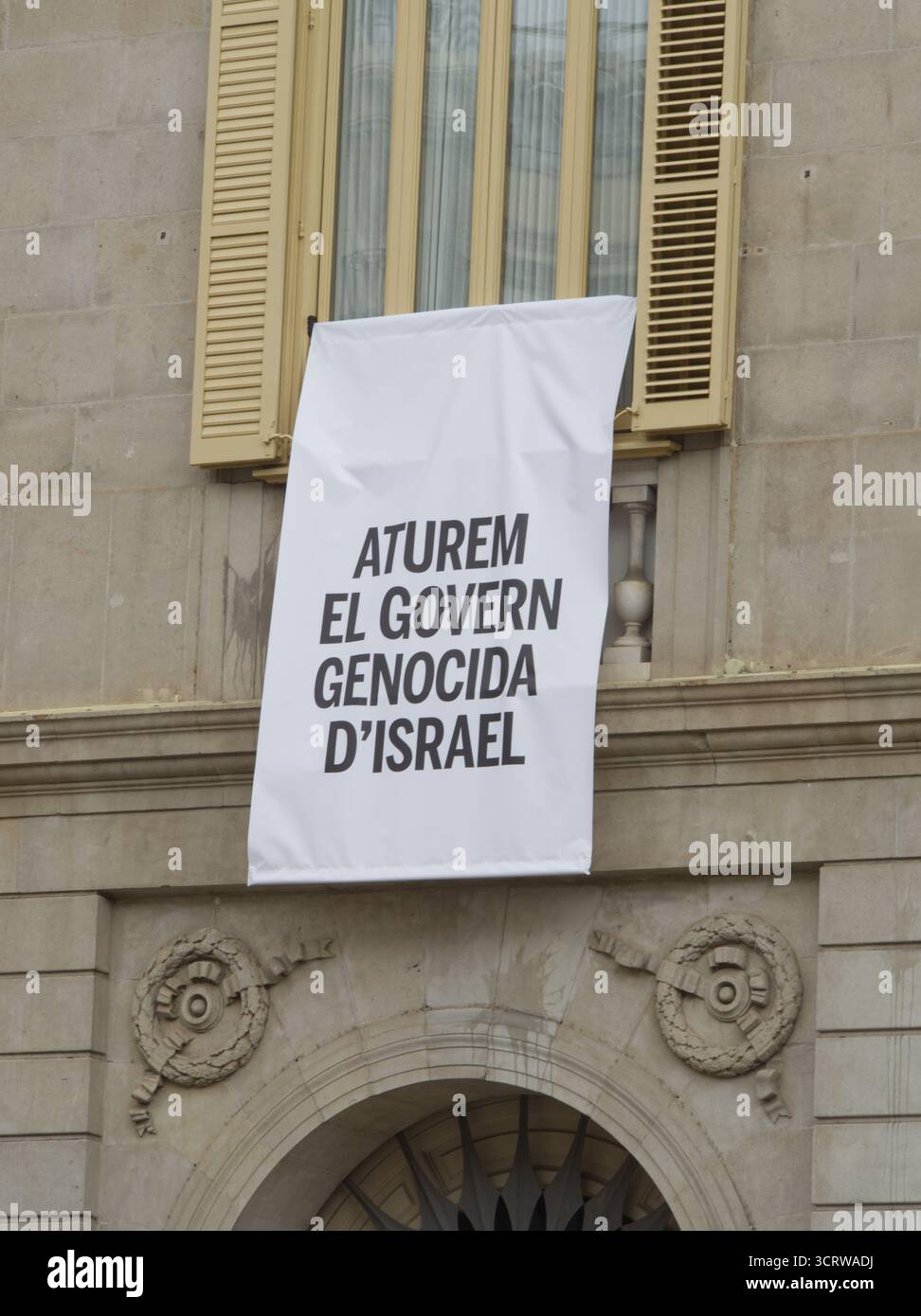 Banner in Catalan hanging on Barcelona's city hall reading "Stop Israel's genocidal government". Stock Photo
