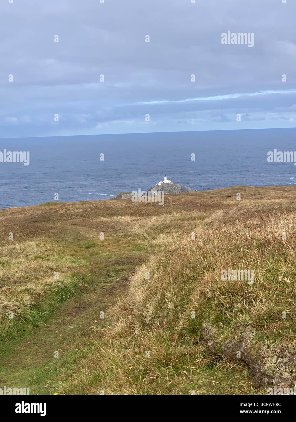 Shetland island sea water green hills birds rocks rock information spray white sky hot summer edge top walk walkers rocky land landscape walking - Smartphone Captured Stock Image