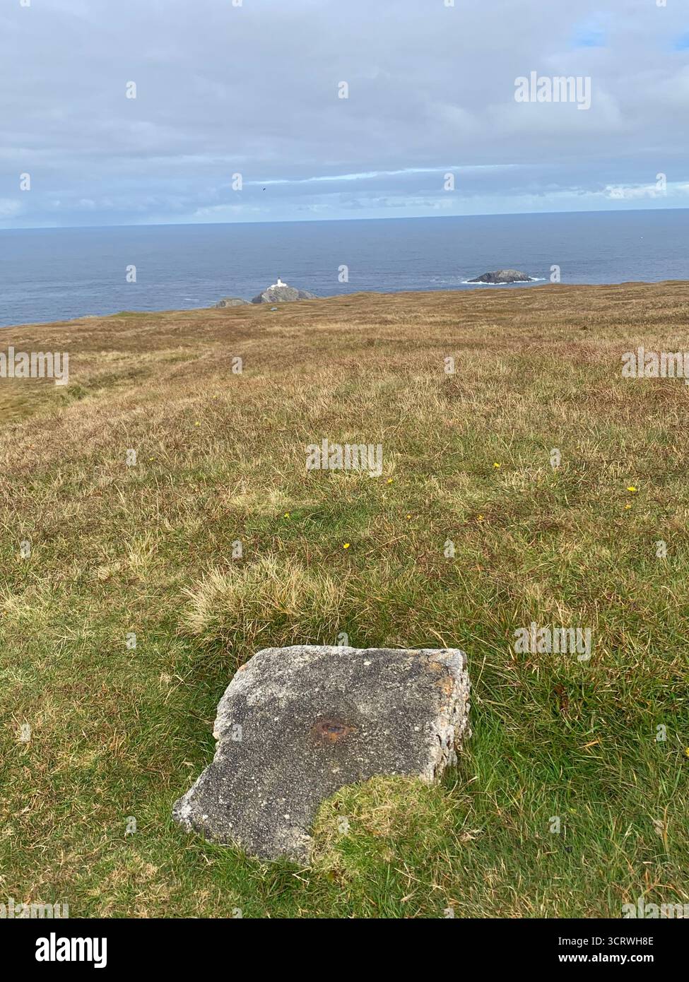 Shetland island sea water green hills birds rocks rock information spray white sky hot summer edge top walk walkers rocky land landscape walking - Smartphone Captured Stock Image