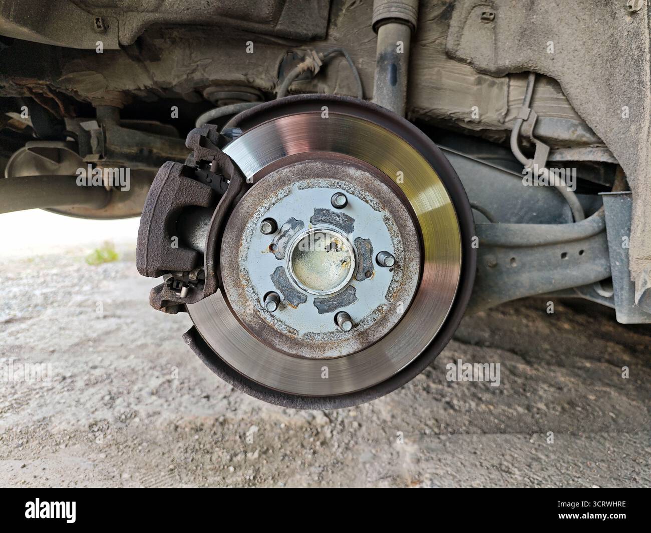 Wheel Assembly Disc Close-up of disc brake assembly with the wheel removed, showing the ...