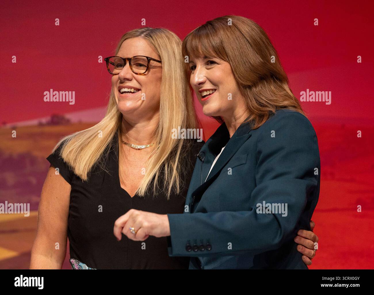 rachel-reeves-chancellor-of-the-exchequer-hugs-her-sister-ellie-solicitor-general-for-england-and-wales-and-waves-after-her-labour-conference-speech-3CRX0GY.jpg