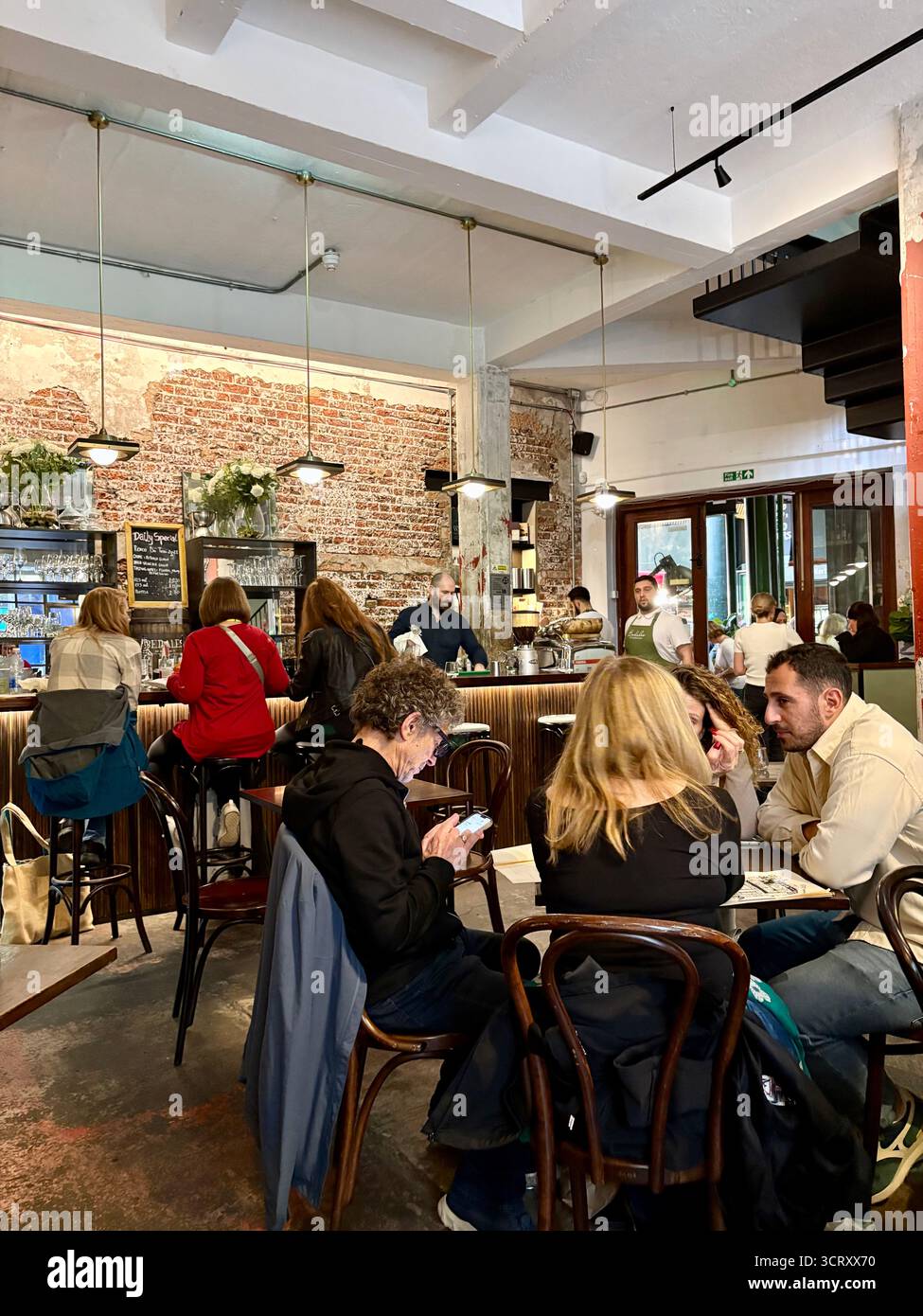 London Borough market, Bedales of Borough wine bar and restaurant, interior, people eating lunch and drinking, England,UK - Smartphone Captured Stock Image