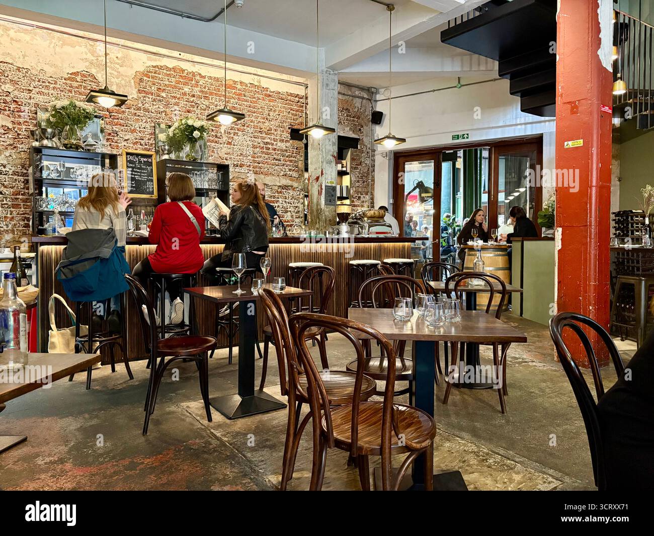 London Borough market, Bedales of Borough wine bar and restaurant, interior, people eating lunch and drinking, England,UK - Smartphone Captured Stock Image