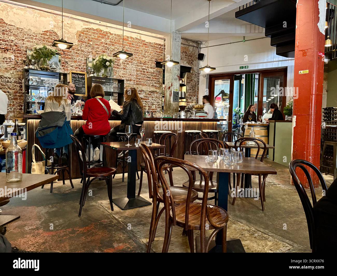 London Borough market, Bedales of Borough wine bar and restaurant, interior, people eating lunch and drinking, England,UK - Smartphone Captured Stock Image