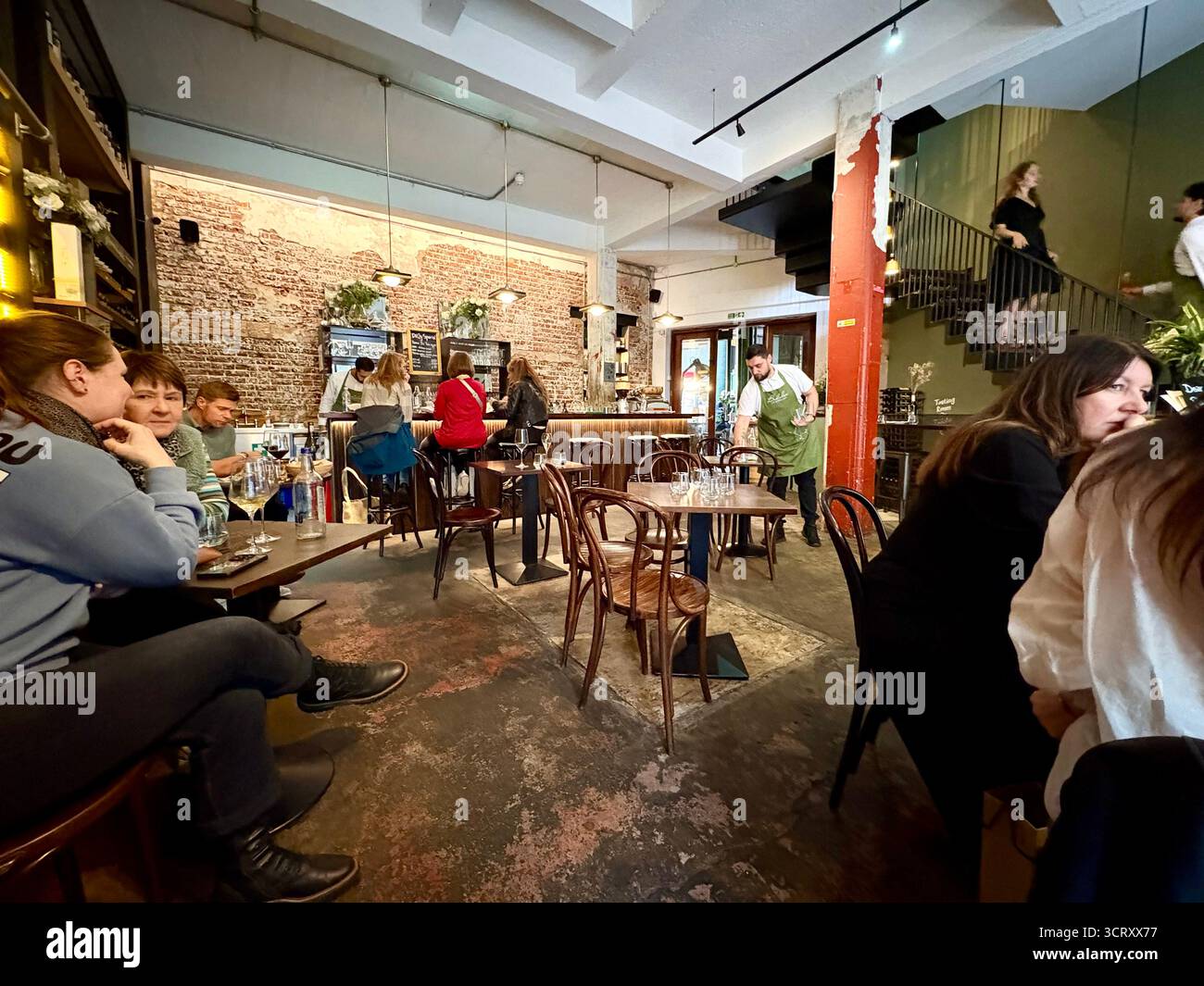 London Borough market, Bedales of Borough wine bar and restaurant, interior, people eating lunch and drinking, England,UK - Smartphone Captured Stock Image