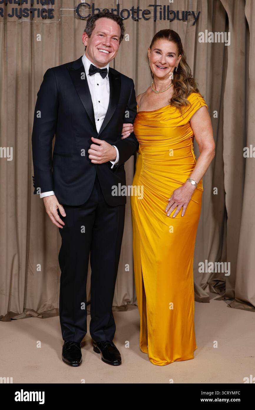 Philip Vaughn, left, and Melinda French Gates pose for photographers
