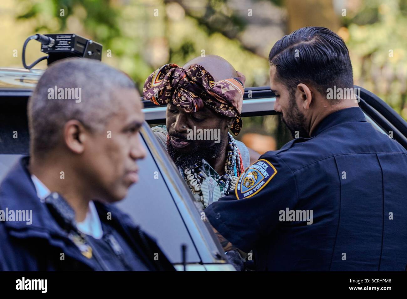 A person is detained outside the Manhattan federal court during the