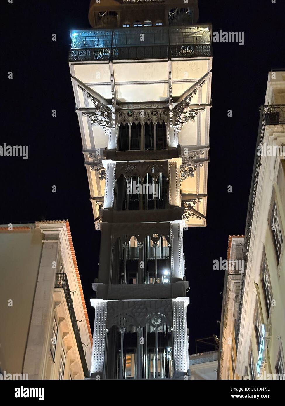 Lisbon, Portugal, Santa Justa Lift , Elevador de Santa Justa, night time view illuminated against dark sky, linking the Baixa with the Bairro Alto - Smartphone Captured Stock Image