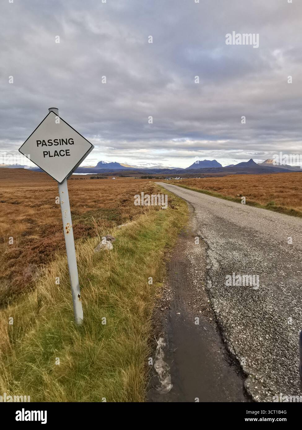 Passing place sign on remote single track road from Altandhu to Achiltibuie, Assynt—views to Suilven, Canisp, Cul Mòr and Stac Pollaidh, NC500. - Smartphone Captured Stock Image